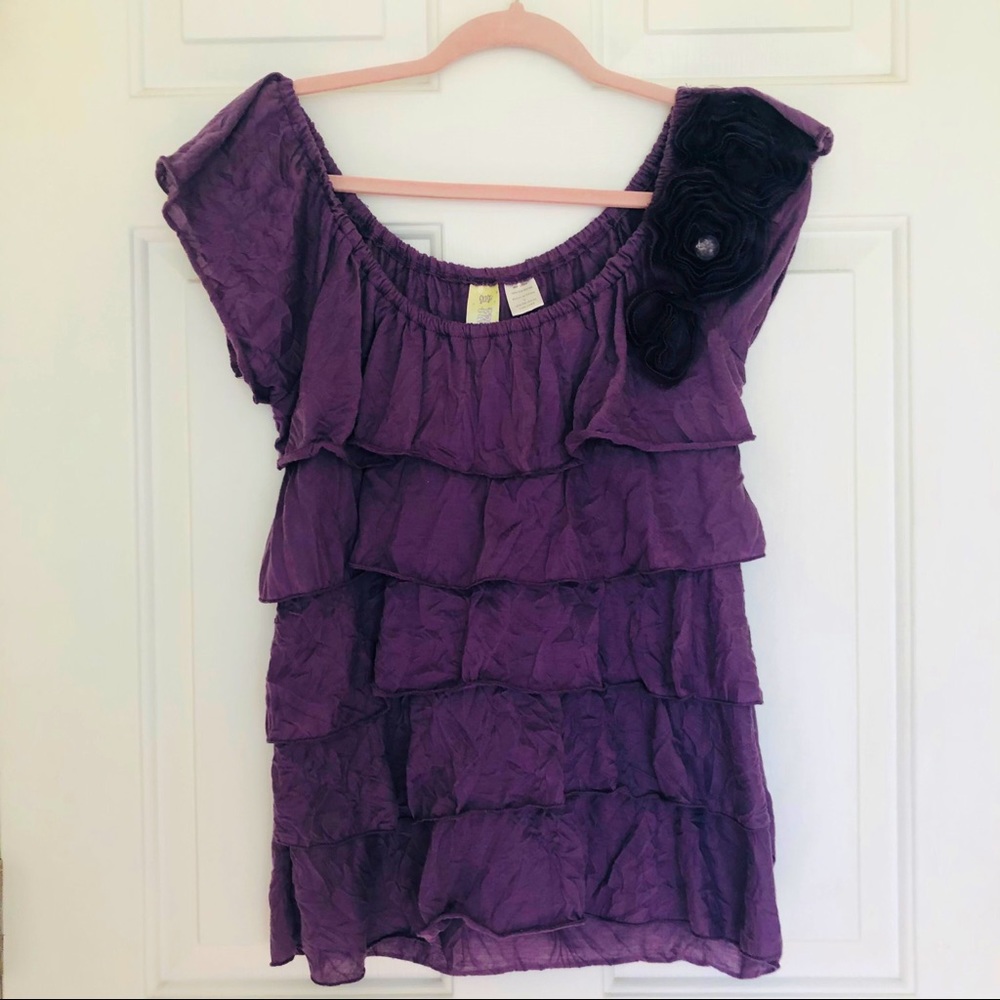Purple ruffle shirt with floral appliqué